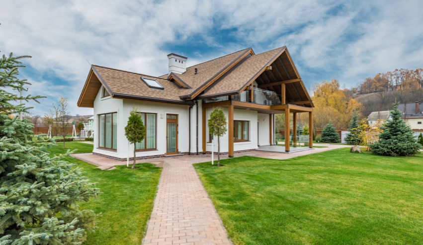 cottage style house with grass yard