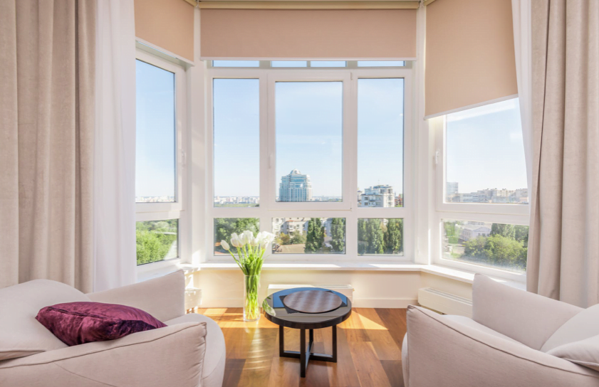 white apartment with bay windows looking over the city