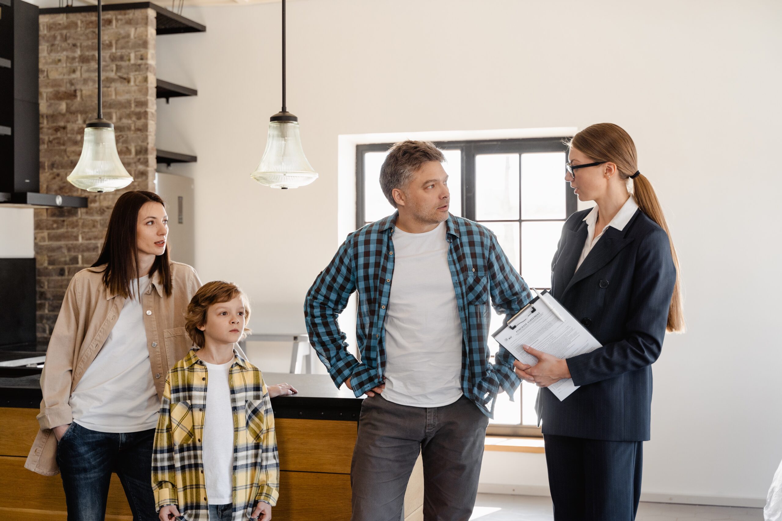 family and realtor during a house tour