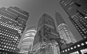 Modern office skyscrapers illuminated at night in downtown.